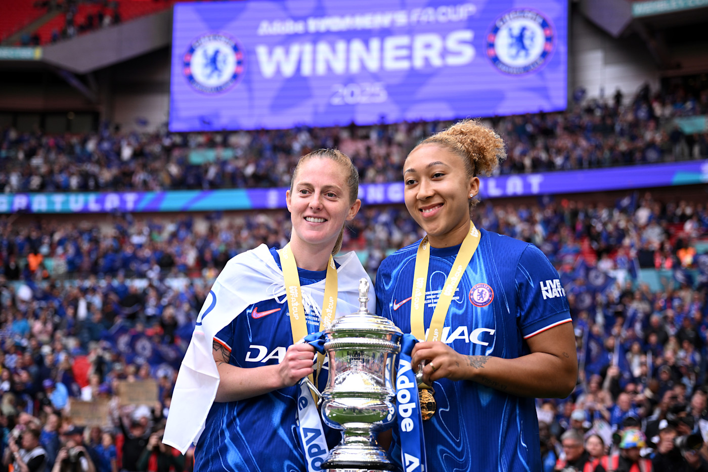 Walsh with one of the three trophies she has already won at Chelsea